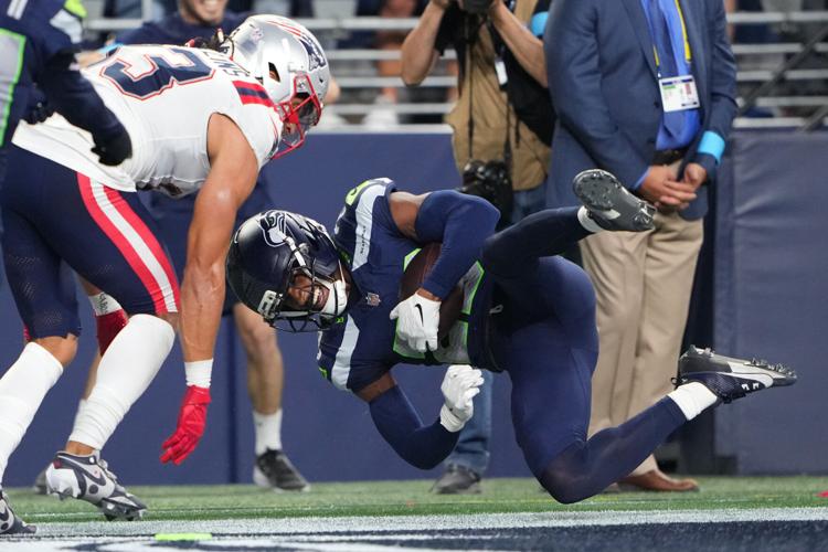Photos of the NFL season opener, a rare Super Bowl rematch between the Seahawks and Patriots
