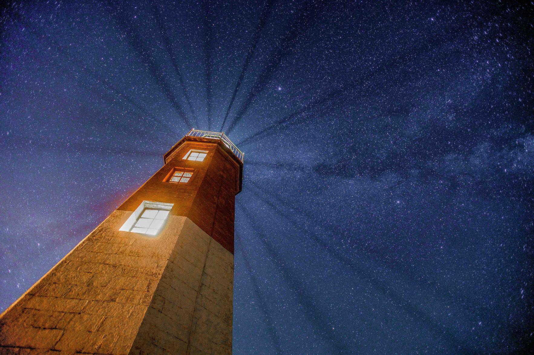 Local photographer captures the brilliance of lighthouses at night
