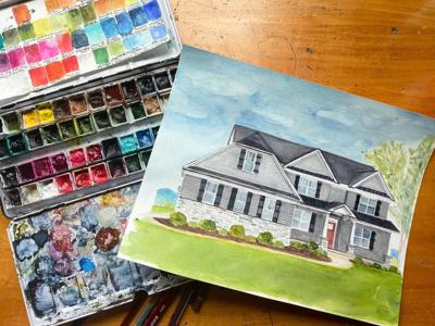Artist paints houses