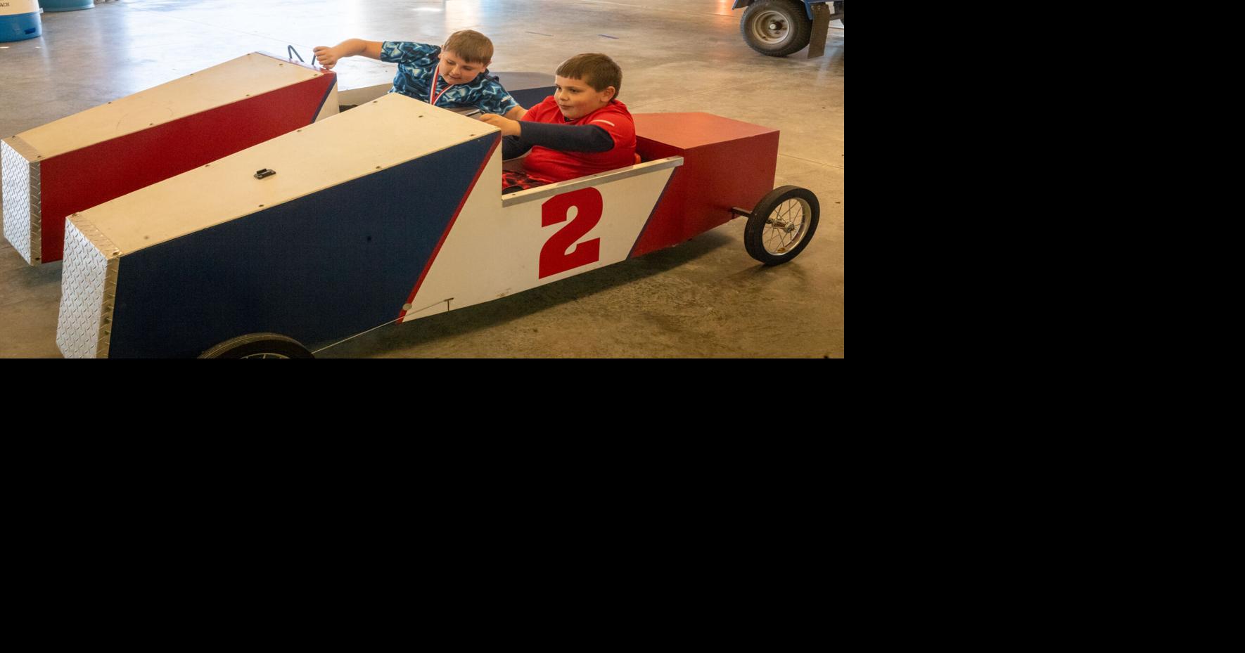two racers in antique boxcar racing machines.JPG | | insidenova.com