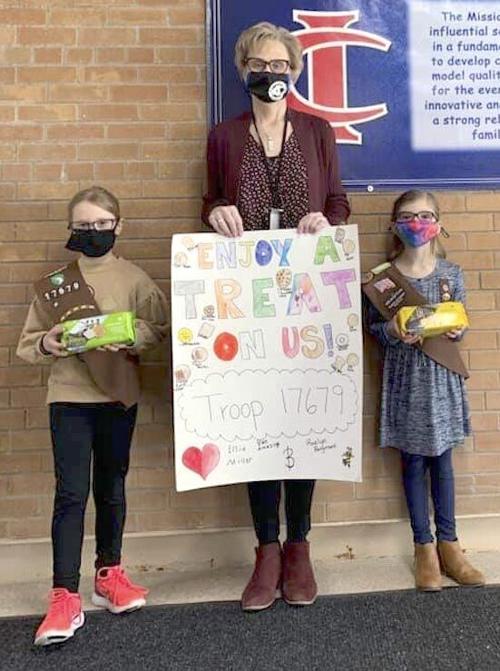 Girl Scouts make cookie donation to school