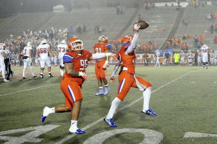 (Joshua Yates/The Huntsville Item) Sam Houston State senior linebacker Tristan Eche, right, celebrates with Sione Latu after recovering a fumble in the final minute of Saturday's 42-39 victory over Southern Utah in the first round of the NCAA Football Championship Subdivision playoffs on a rainy night at Bowers Stadium. 