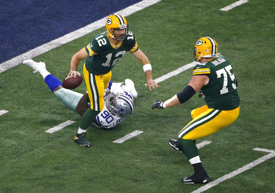 The Latest Packers beat Cowboys on Rodgers� late TD pass The Latest Packers beat Cowboys on Rodgers� late TD pass
