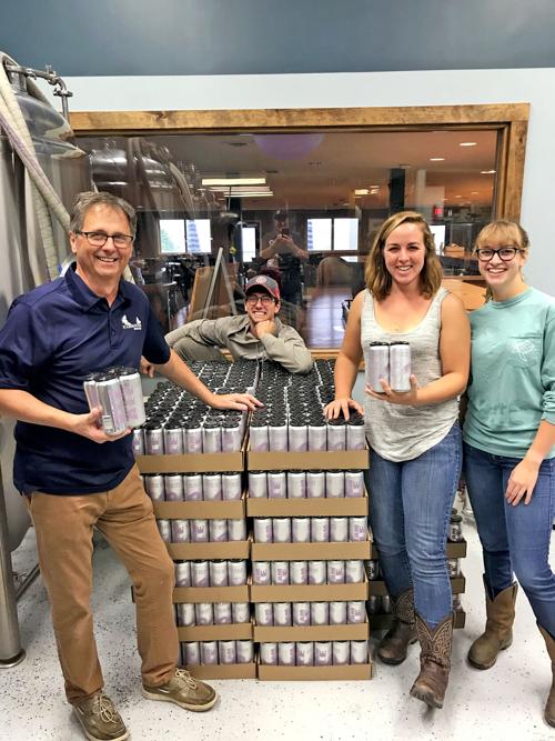 Stephen Fazzary (left), who passed away Sept. 6 after a seven-month battle with cancer, and his canning crew at Scale House Brewpub.