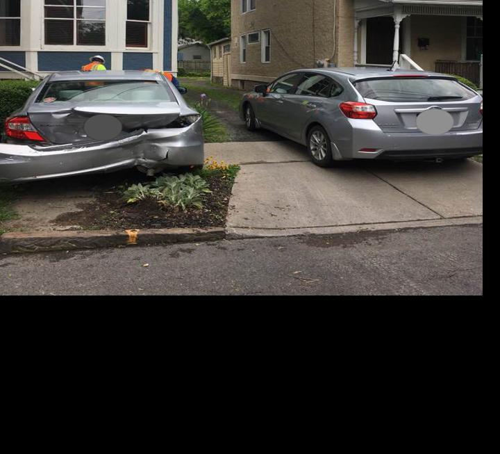 House barely avoids damage after motor vehicle accident in downtown