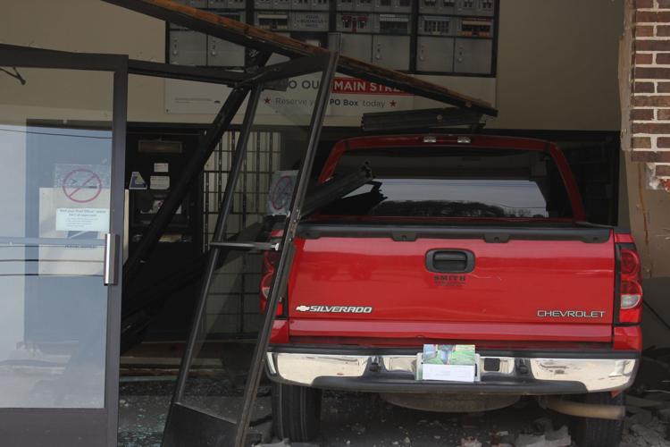 Vehicle drives through Jasper Post Office Marion County