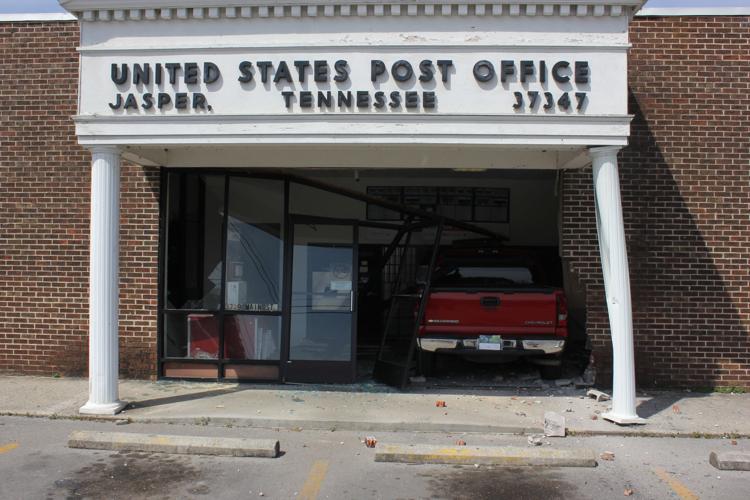 Vehicle drives through Jasper Post Office Marion County