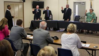 Recently elected school board members take the oath of office | News ...