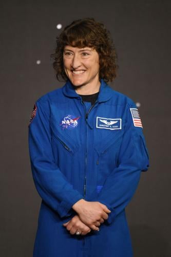 Astronaut Christina Koch looking out Orion spacecraft window