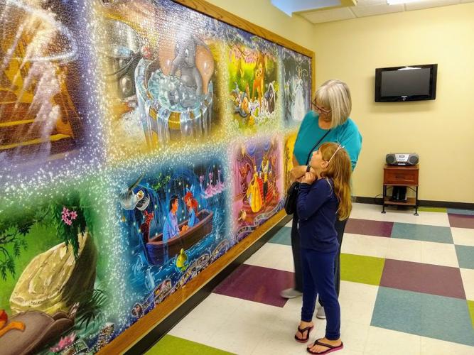 Charleston library unveils 40,320 piece Disney jigsaw puzzle