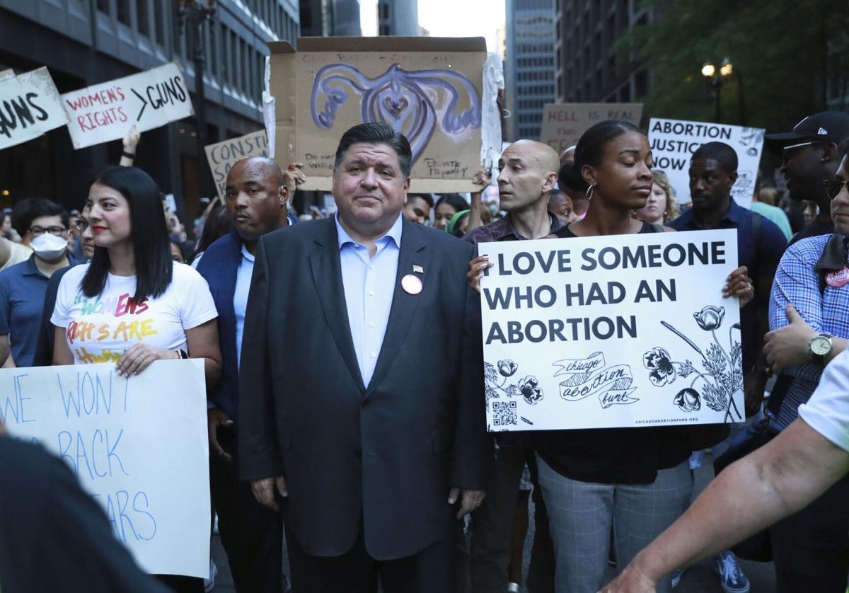 Gov. J.B. Pritzker participates in a rally at Chicago's Federal Plaza on June 24, 2022, in reaction to the Supreme Court overturning Roe v. Wade, allowing states to ban abortions.