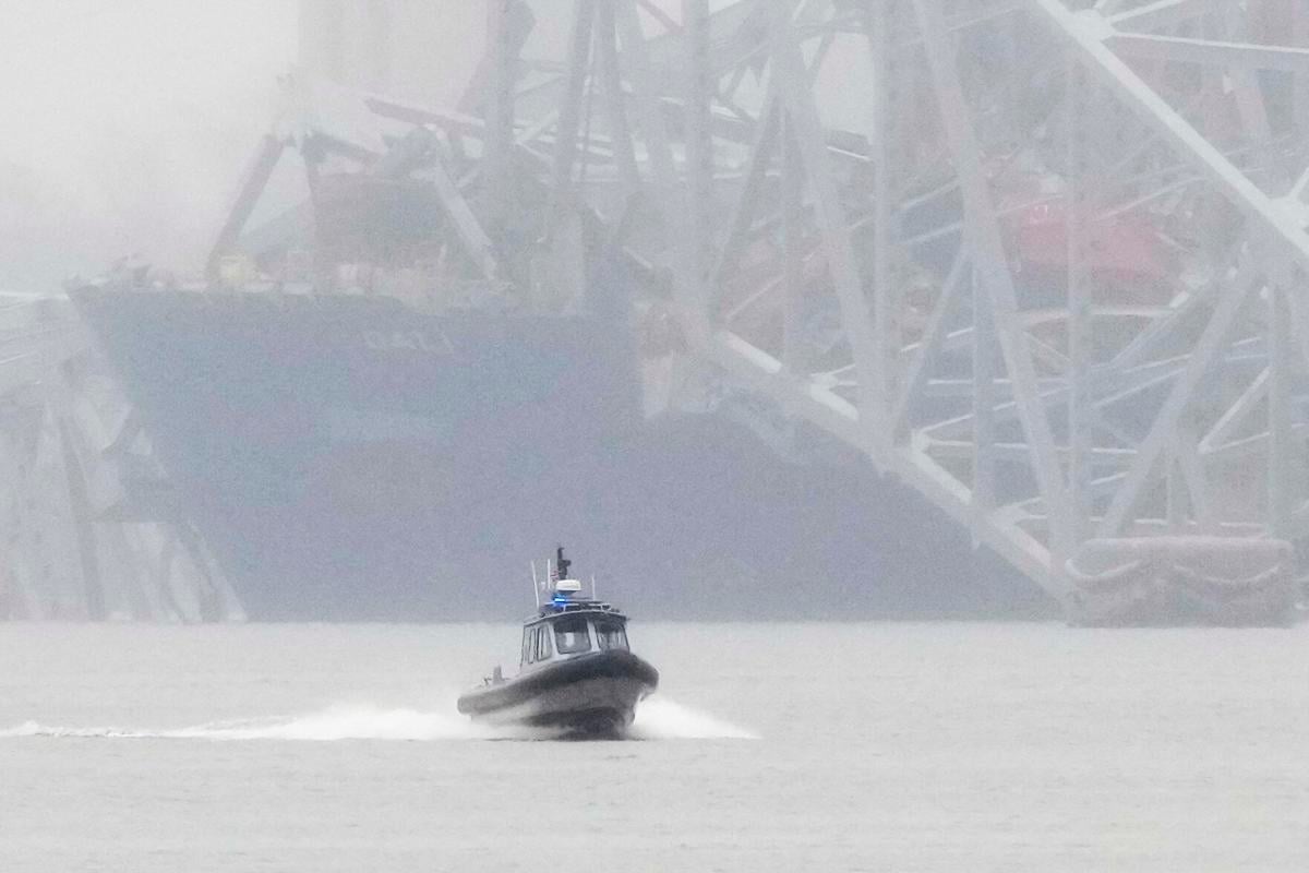 Investigation picks up as divers search for missing workers