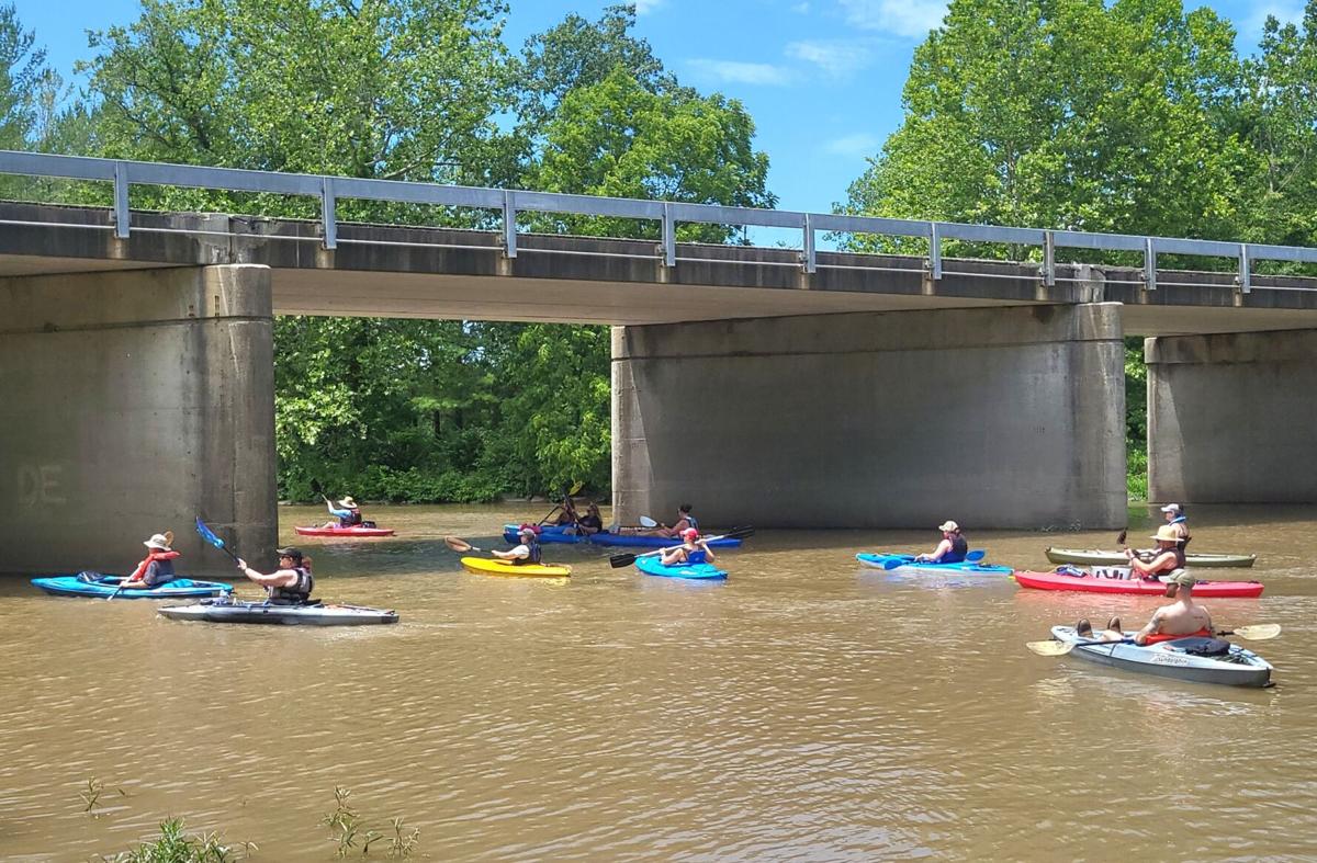 Large groups paddling down the Embarras River at new free kayaking