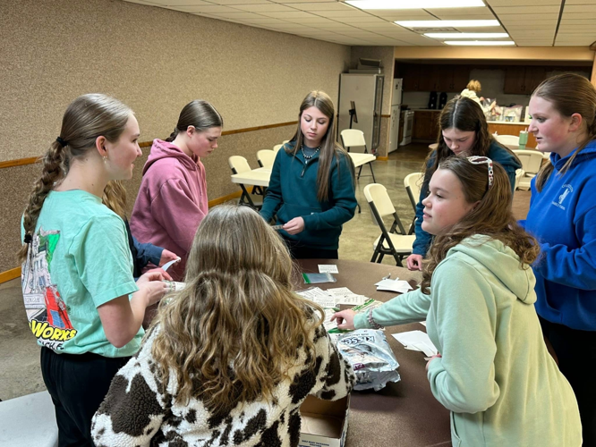 Barnstormers preparing a treat to add to the meal kits