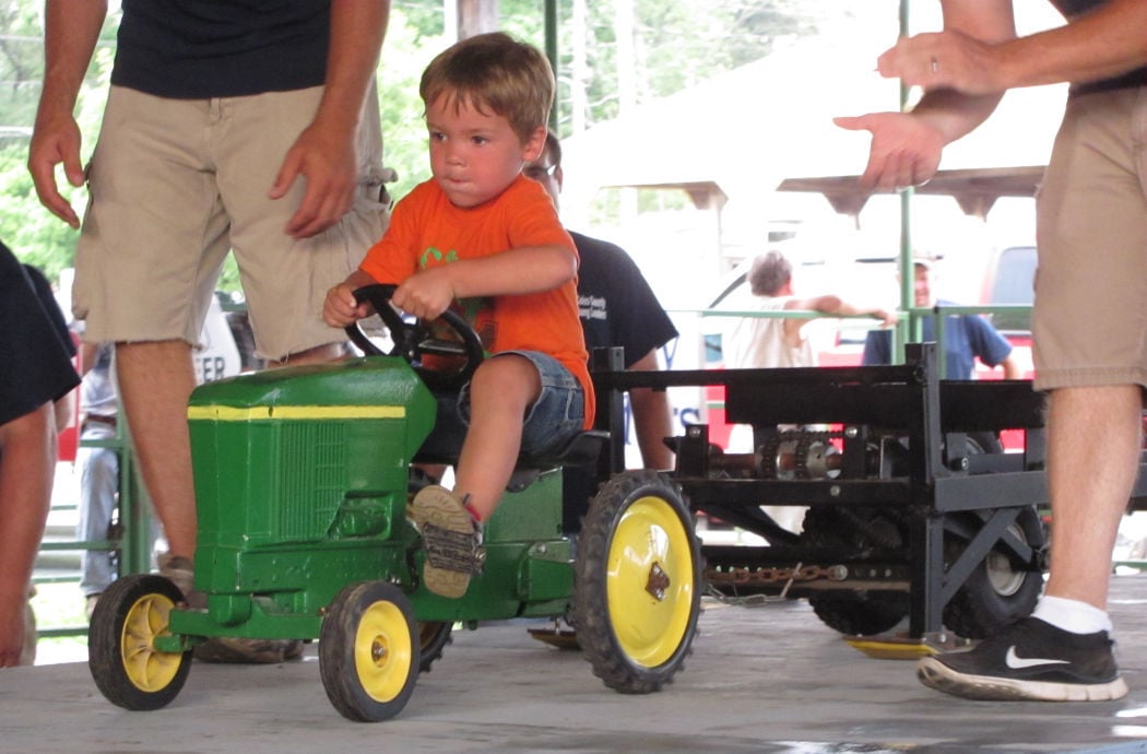 Children compete in Coles County Fair pedal tractor pull