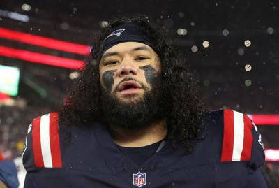Khyiris Tonga #95 of the New England Patriots reacts after a 28-16 victory against the Houston Texans the AFC Divisional Playoff game at Gillette Stadium on Jan. 18, 2026, in Foxborough, Massachusetts.