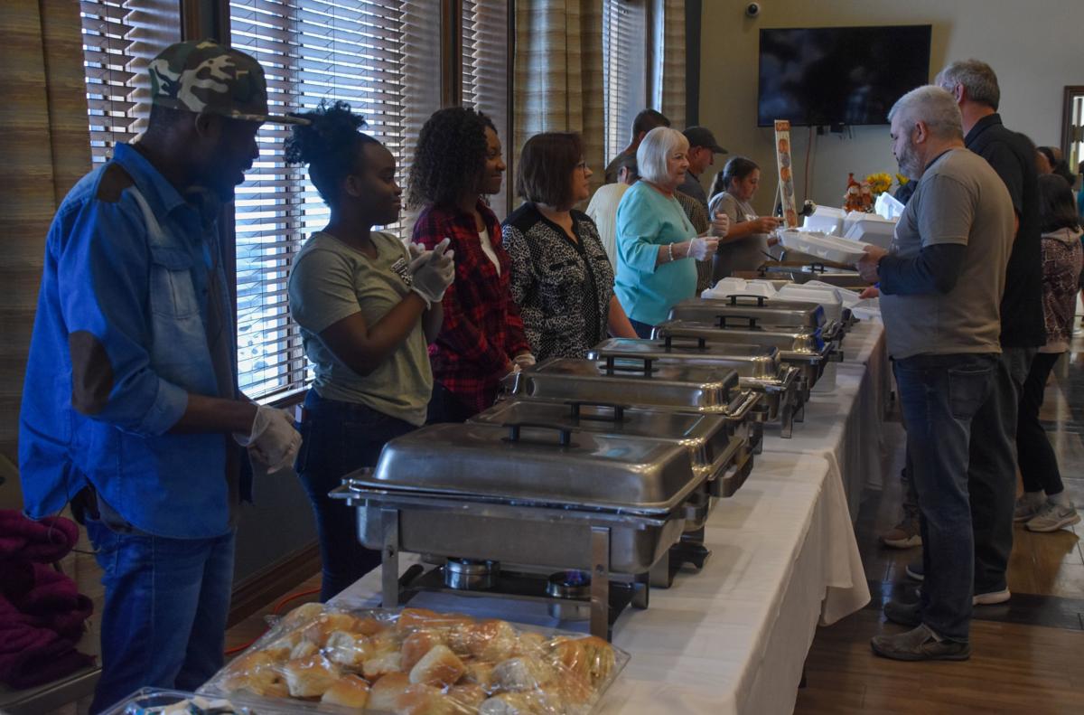 Volunteers help Charleston Thanksgiving dinner grow Local