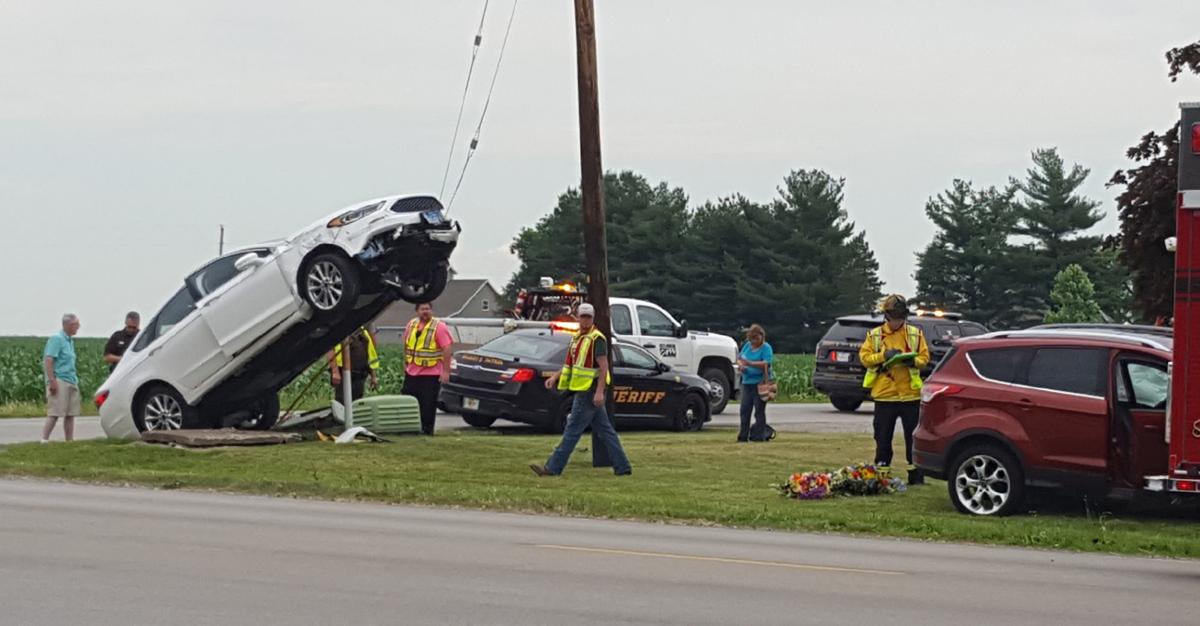 auto runs up guy wire due to accident local