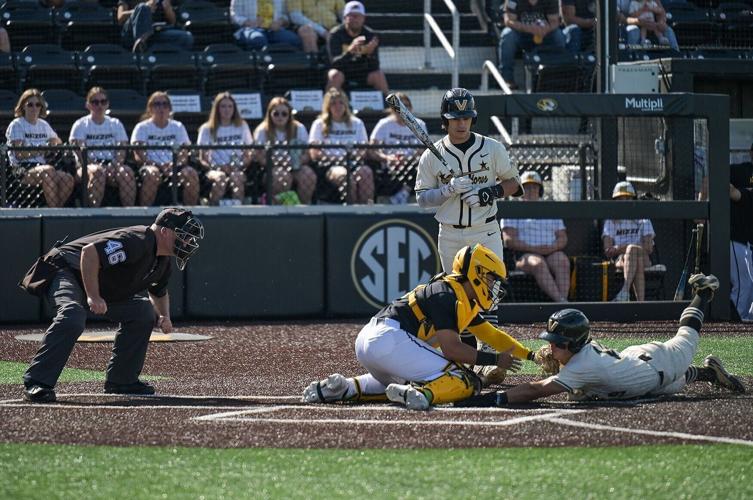 Vanderbilt center fielder Rustan Rigdon attempts to steal home