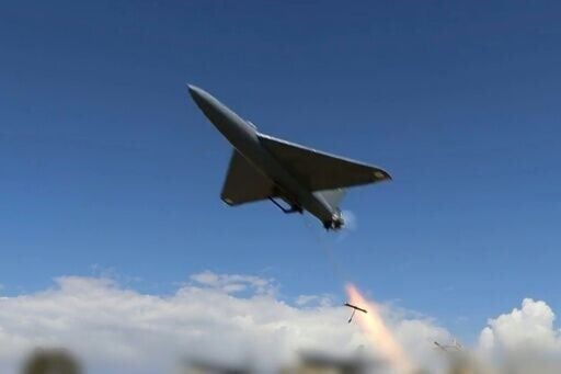 This grab taken from a video released by Iran's state broadcaster (IRIB) on April 6, 2026, shows what it says are drones launched at US targets at Saudi Arabia's Al-Kharj base and Kuwait's Al-Adiri base