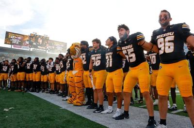 Mizzou players sing the alma mater with the student section