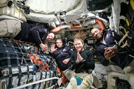 This screen grab from NASA's feed released on April 3, 2026, shows the four Artemis 2 crew members (L-R) Jeremy Hansen, Reid Wiseman, Christina Koch and Victor Glover, as they head to orbit the Moon for the first time in more than half a century