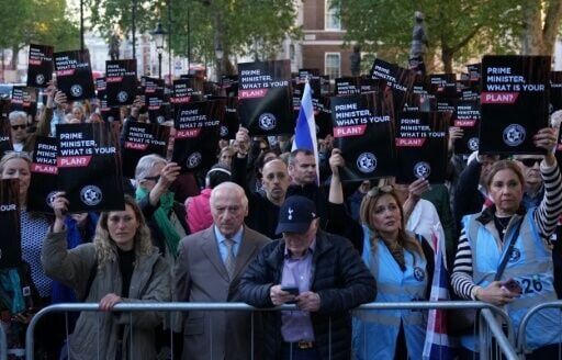 People attend a rally organised by the Campaign Against Antisemitism, opposite Downing Street