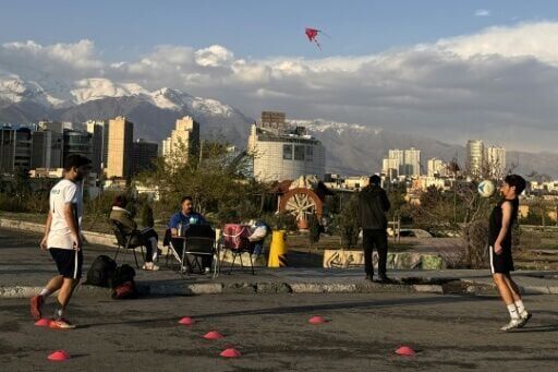 Some young residents of Tehran exercised, flew kites and held picnics in a park on Sunday despite the threats