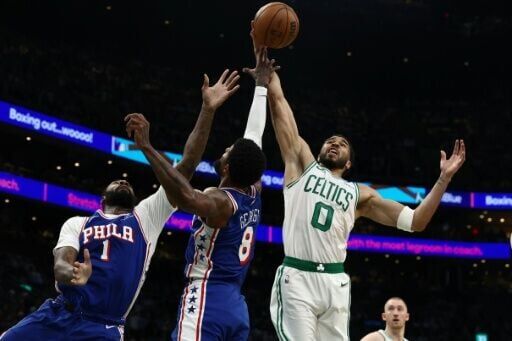 Jayson Tatum (R) of the Boston Celtics led the charge, racking up 21 points in the first half