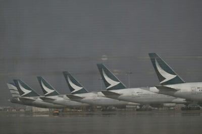 Cathay Pacific aircraft are seen outside the maintenance hanger at the international airport in Hong Kong on September 3, 2024