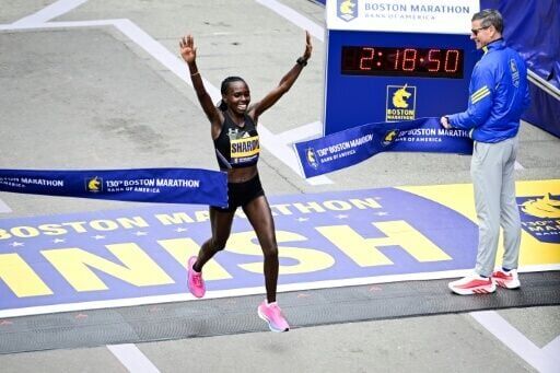 Kenya's Sharon Lokedi celebrates defending her Boston Marathon title