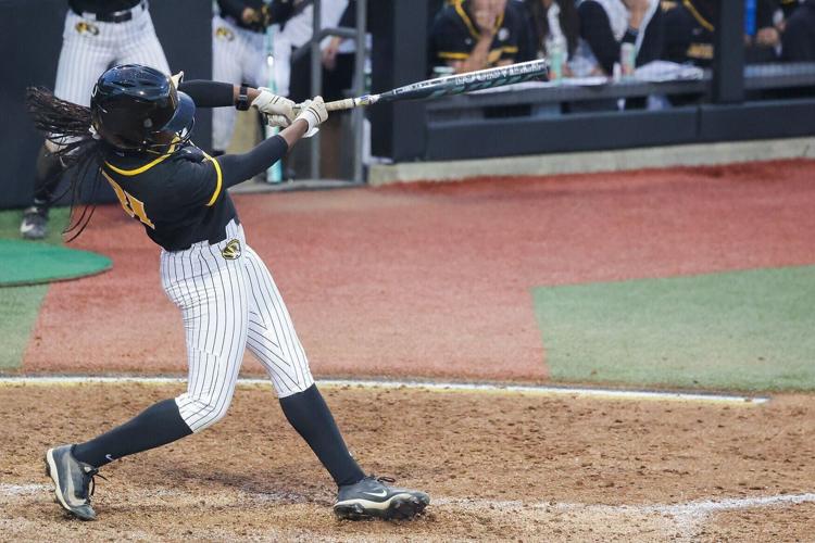Mizzou third baseman Saniya Hill bats