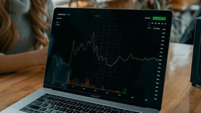 Stock Market Chart Displayed on Laptop
