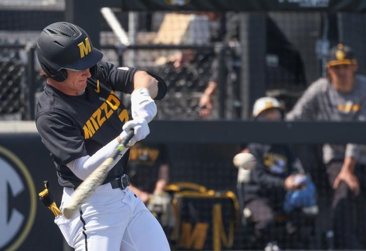 Mizzou infielder Kam Durnin (27) swings for the ball