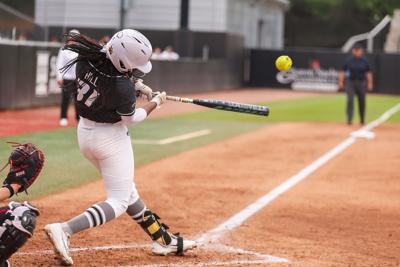 Mizzou infielder Saniya Hill (31) connects and drives the ball (copy)