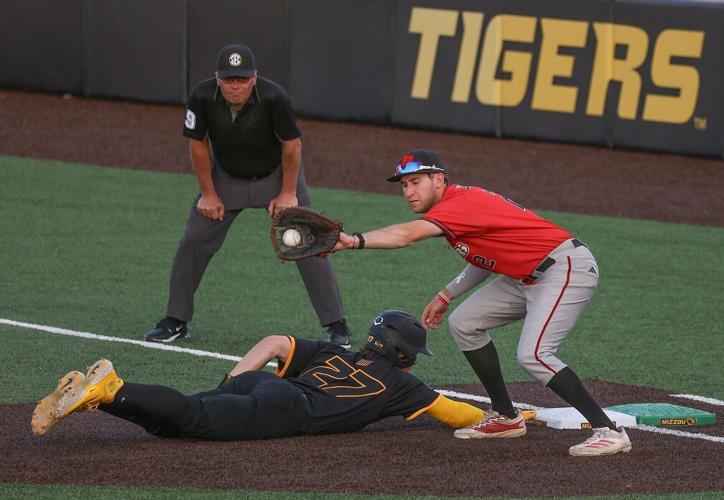 Mizzou’s Cam Durnin slides back into first base safely after a pickoff attempt