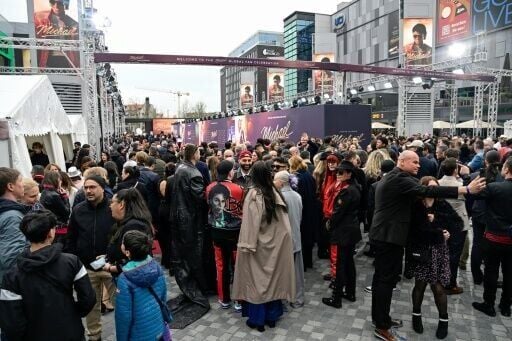Fans wait for guests to arrive on the red carpet for the biopic