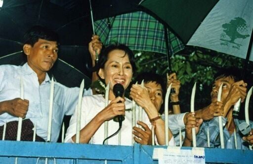 Aung San Suu Kyi speaks to supporters in Yangon a few days after the military junta ended her six years of house arrest, in July 1995