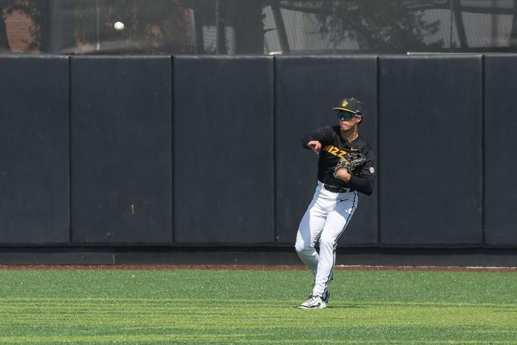 Mizzou outfielder Kaden Peer (7) throws the ball infield