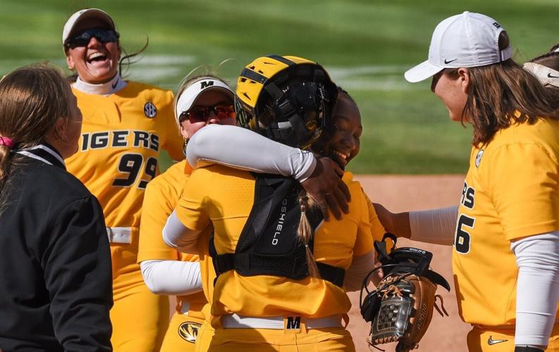 Stefania Abruscato (7) hugs Cierra Harrison (17) after Mizzou softball’s game