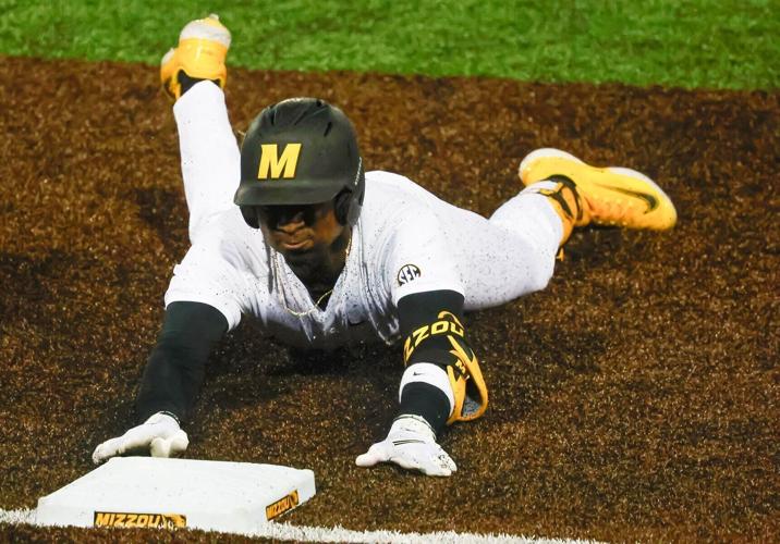 Mizzou right fielder Pierre Seals slides to third base