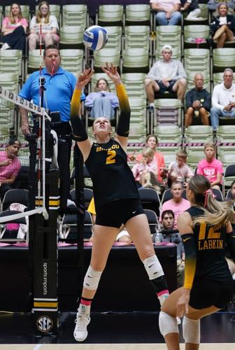 Mizzou setter Sierra Dudley sets a ball to middle blocker Lauren Larkin