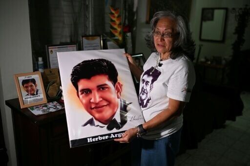'"There are only two possibilities: he's alive or he's dead. What I want is to find him. I don't want to hear about who's responsible anymore,' Carmen Armero whose son Herber Argueta has been missing since 2021, told AFP