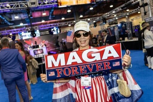 A woman shows off MAGA-branded merchandise at the Conservative Political Action Conference (CPAC) in Grapevine, Texas, where Republicans were split over whether the party should lean harder into Trumpism