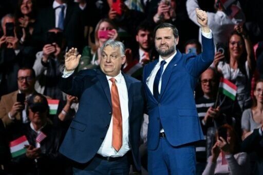JD Vance (R) spoke at a rally with Viktor Orban (L) in an indoor sports arena