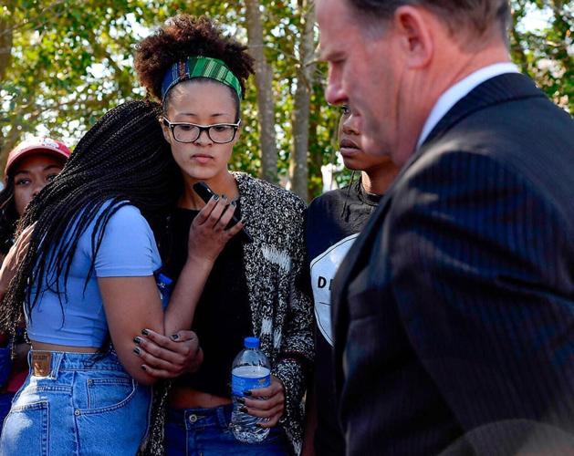 UM System President listens to a speaker phone call from concerned student