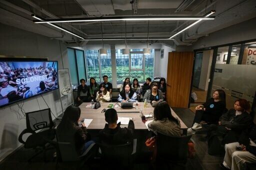 SoloNest founder Karen Dai (centre) sharing her experience with participants during a coffee chat