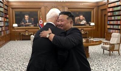 Russian Defence Minister Andrey Belousov and North Korean leader Kim Jong Un embrace during a meeting in Pyongyang