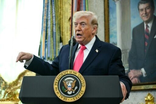 US President Donald Trump, seen here in the Oval Office on March 24, said negotiations with Iran to end the Middle East war were underway "right now"