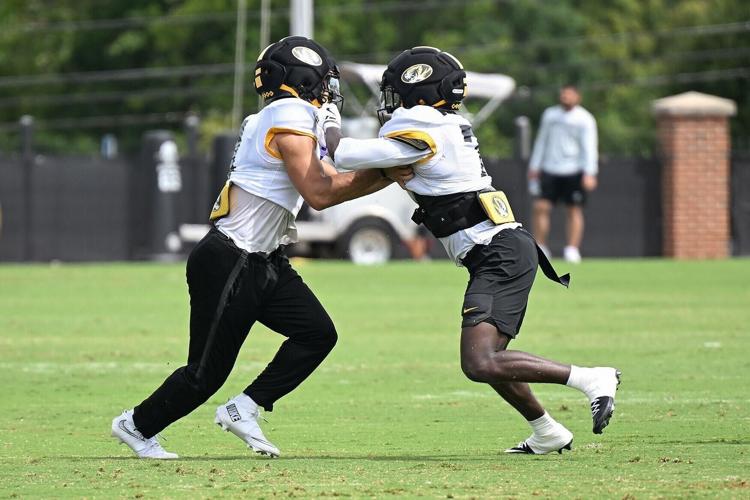 Safeties Trajen Greco (4), left, and Kensley Louidor-Faustin (7) practice